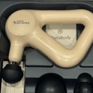 Therabody Beige and Black Massage Device